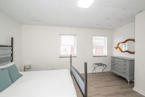 A plush queen-sized bed awaits in the second bedroom sanctuary
