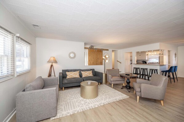 Unwind in the stylish living room & stream your favorites on the smart TV