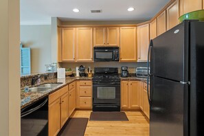 Craft your favorite dishes in the fully equipped kitchen