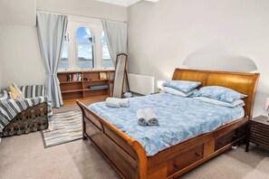 Master bedroom with kingsize bed and seaviews