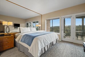 Bedroom 1 with King bed, balcony access, and en-suite bathroom