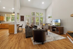 Cozy and spacious living area with TV and fireplace