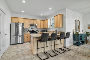 Sip morning coffee or grab a bite at the kitchen counter, with seating for 4