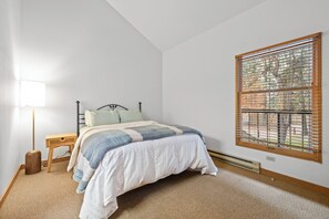 Bedroom with queen bed and Smart TV