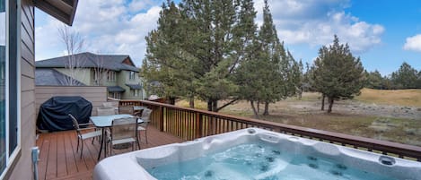 Bask in bubbling bliss with golf course views in the private hot tub!