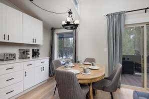 Gather for meals together at the table, offering seating for 4