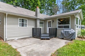 Back deck with access to the backyard and BBQ.