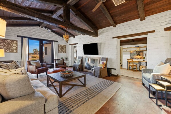 Sink into this one-of-a-kind rustic cottage surrounded by private farmland  