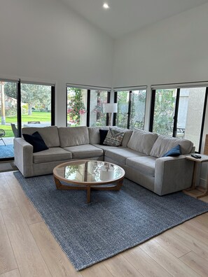 Spacious and comfy family room with 75 inch TV