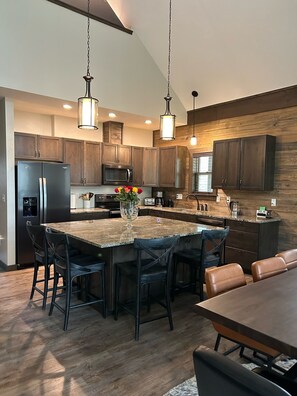 Large, roomy  kitchen for making meals together.