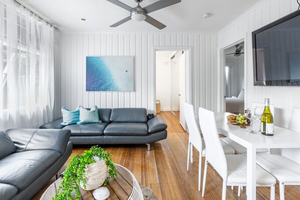 Open plan kitchen living and dining with aircon and fans