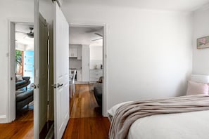 Queen bedroom with fan, built in robes and luxury linen