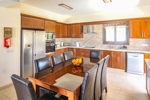 Kitchen area with dining table for 8