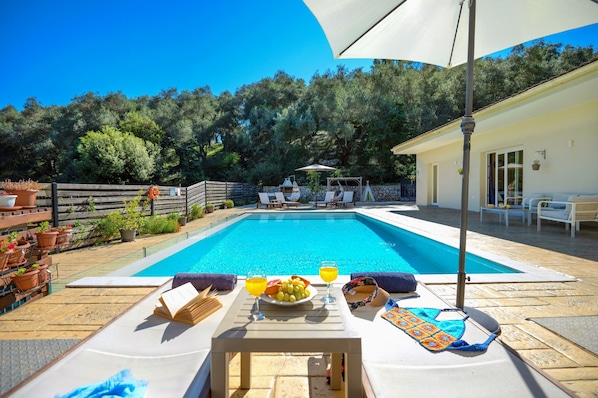 Pool perspective from sunloungers