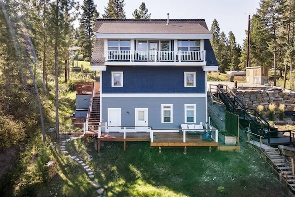 Beautiful home exterior facing stunning views of the lake and mountains!