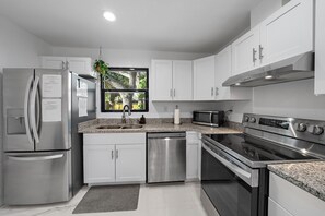 New stainless steel appliances, and such an incredible kitchen bar. You'll be cooking in luxury!