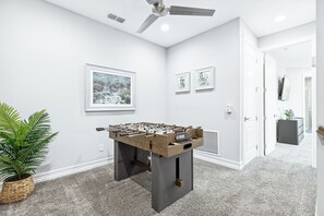 Challenge friends to a foosball match! A perfect spot to unwind and have fun.