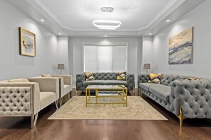 Open concept modern spacious Living room with   plenty of seating arrangement