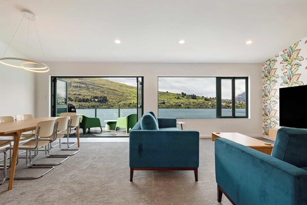 Living area with lake and mountain views