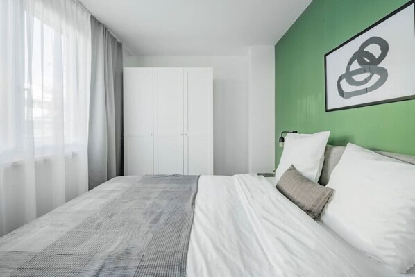Welcome to your bedroom, a tranquil retreat where Arbio Designers have crafted an oasis of relaxation around your comfortable bed.