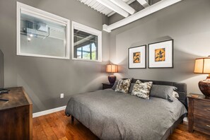 Primary bedroom with king-sized bed and ensuite bathroom.