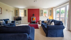 Open the French doors to bring the outdoors in to this spacious living room