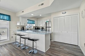 The kitchen counter provides additional  space for serving snacks or meals.
