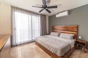 Relax in a spacious bedroom with a plush king-sized bed and soft linens.