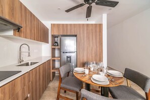 Enjoy meals with loved ones at this cozy dining table, perfect for family gatherings.