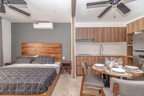 Cozy up in this comfortable bedroom with plush bedding and calming decor.
