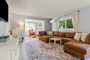 Make yourself at home in this cozy living room – a welcoming space to relax, connect, and enjoy quality time with loved ones.