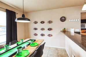 Kick off your stay with a touchdown of comfort! Our football-themed dining space is the perfect spot to fuel up for your next adventure. 🏈✨