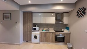 Kitchen
Fully equipped kitchen with oven, microwave, and utensils