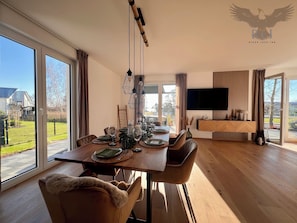 The spacious dining and living area offers a great deal of space for your family and friends.