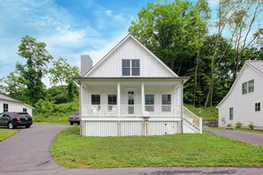 Charming cottage with a rocking chair front porch for morning coffee
