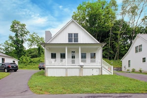 Charming cottage with a rocking chair front porch for morning coffee