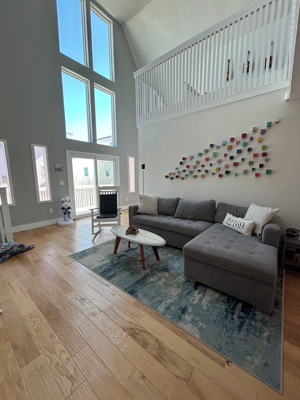 Main floor breathtaking living area with blue sky views