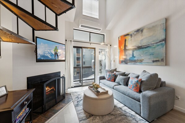 Living room featuring comfortable seating, and balcony