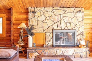 Living room with locally sourced stone fireplace - wood burning