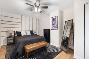 Bedroom 1: Sleep soundly in our spacious bedroom featuring a comfortable queen-sized bed.