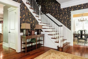 Grand entryway with switchback staircase.