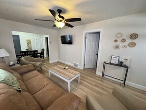 Living room with seating, Smart TV and Board Games