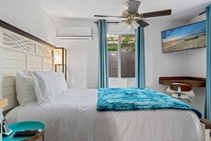 Relax in this vibrant and cheerful bedroom, featuring lively décor and a cozy atmosphere that adds a fun and inviting touch to your stay.