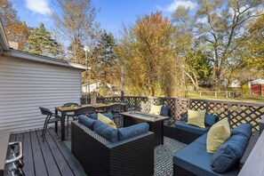 Patio deck area with cozy lounge seating and al fresco dining area