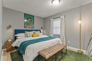 Bedroom 1 with king bed and plush beddings
