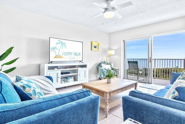 Bright and airy living room with ocean views and cozy coastal decor