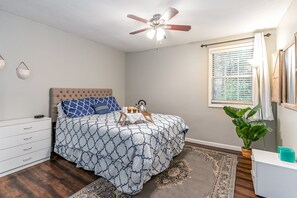Primary Bedroom featuring a Queen bed, closet, and en-suite bathroom.