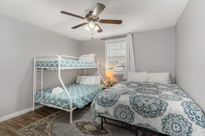 2nd bedroom features a Queen Bed, 1 Twin bed over a Full bed (bunk bed style), a walk-in Closet, and an en-suite jack-n-jill bathroom.