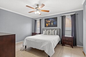 Cozy bedroom with a plush queen bed, soft linens, and a calming vibe—perfect for a restful night's sleep.