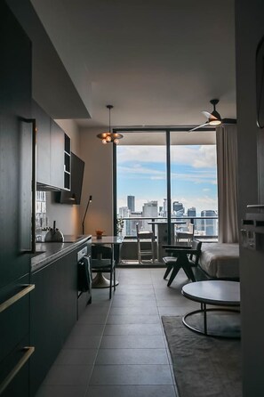Indulge in luxury in our stunning living room & gourmet kitchen. Perfect for entertaining, this sleek space features modern appliances, ample seating & breathtaking views. Ideal for culinary enthusiasts & those seeking a sophisticated retreat.